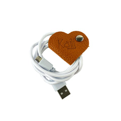K0039LB | Heart Cable Winder Made in Italy in Genuine Full Grain Leather, Dollar Grain - Orange Color - Dimensions: 5 x 8 x 0.5 cm - Packaging: Rigid Gift Box with bottom/lid-0